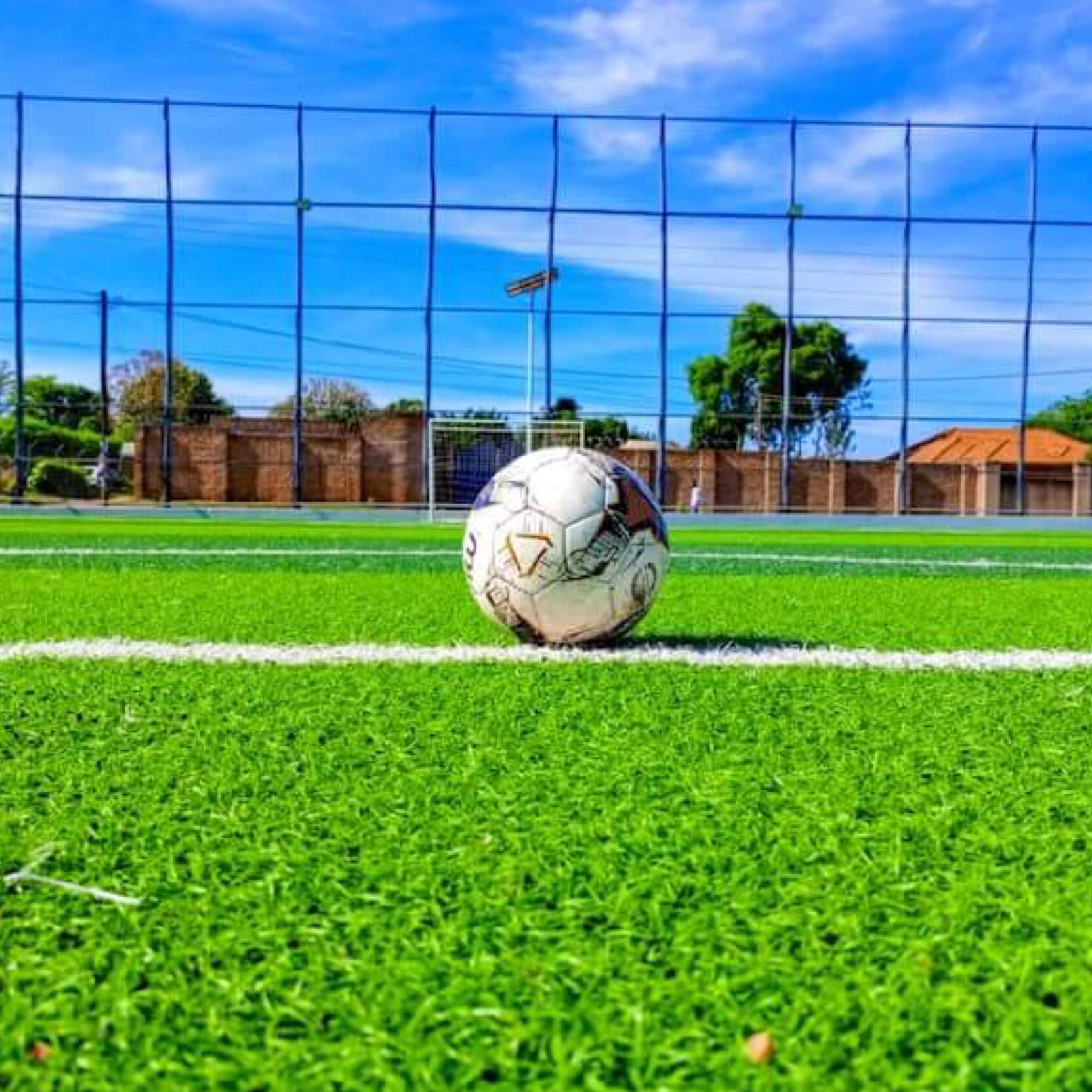 image 1 and 2 are of an artificail turf playing ground with soccer ball, image of artificial playing turf with soccer ball and image 3 is a trophy with golden boot and golden glove by its sides
