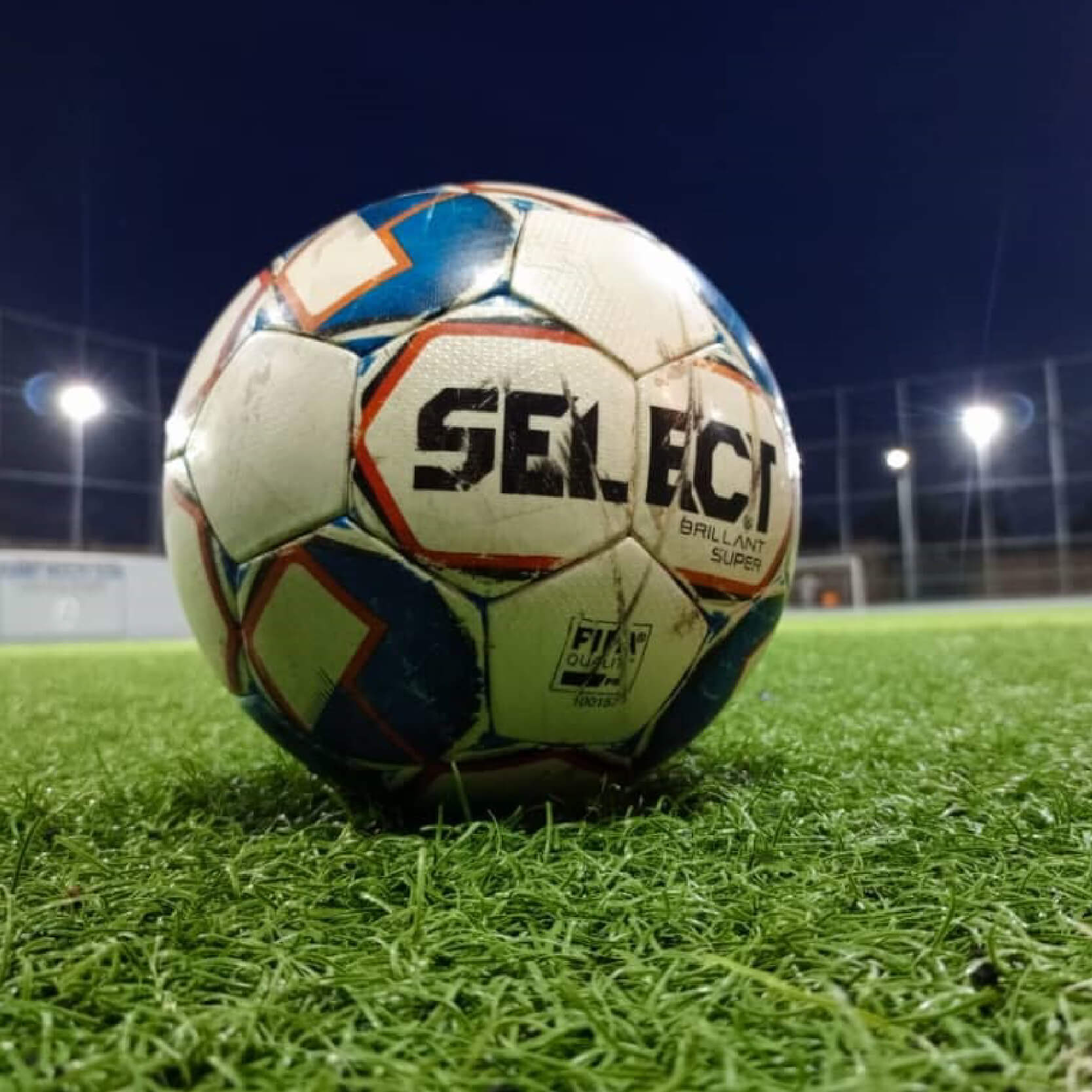 image 1 and 2 are of an artificail turf playing ground with soccer ball, image of artificial playing turf with soccer ball and image 3 is a trophy with golden boot and golden glove by its sides